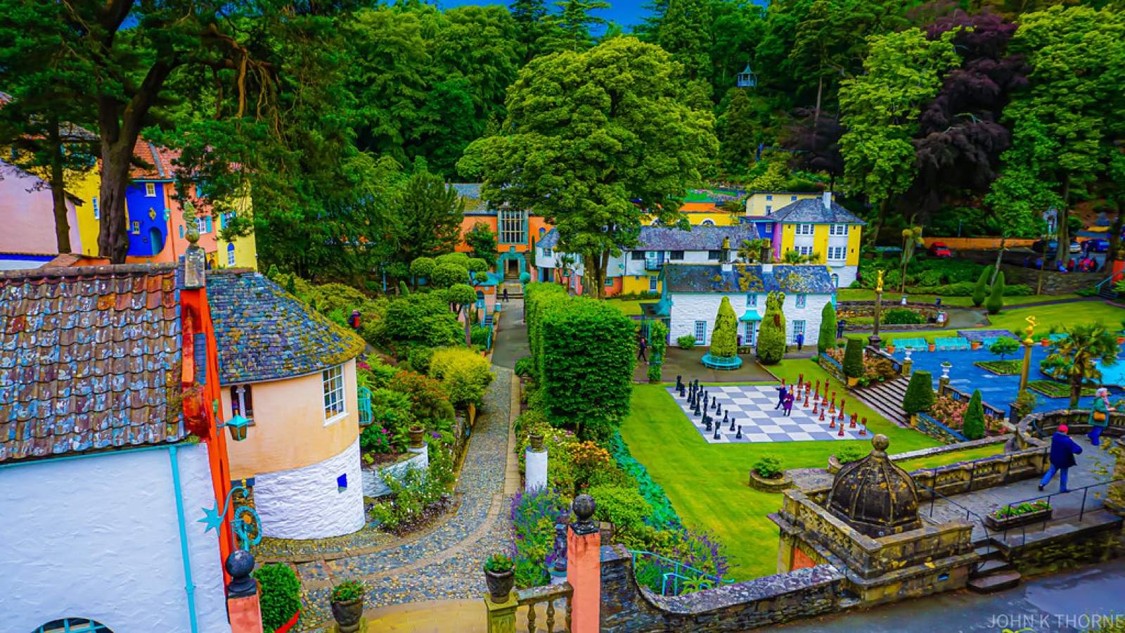 Colorful houses surrounded by wooded hills